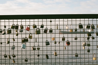 Padlock metal railing near water
